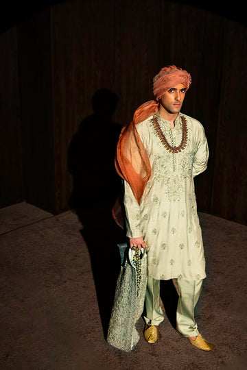 Designer pastel green kurta with waistcoat available online in Pakistan, featuring intricate embroidery and premium fabric, perfect for festive and formal occasions.